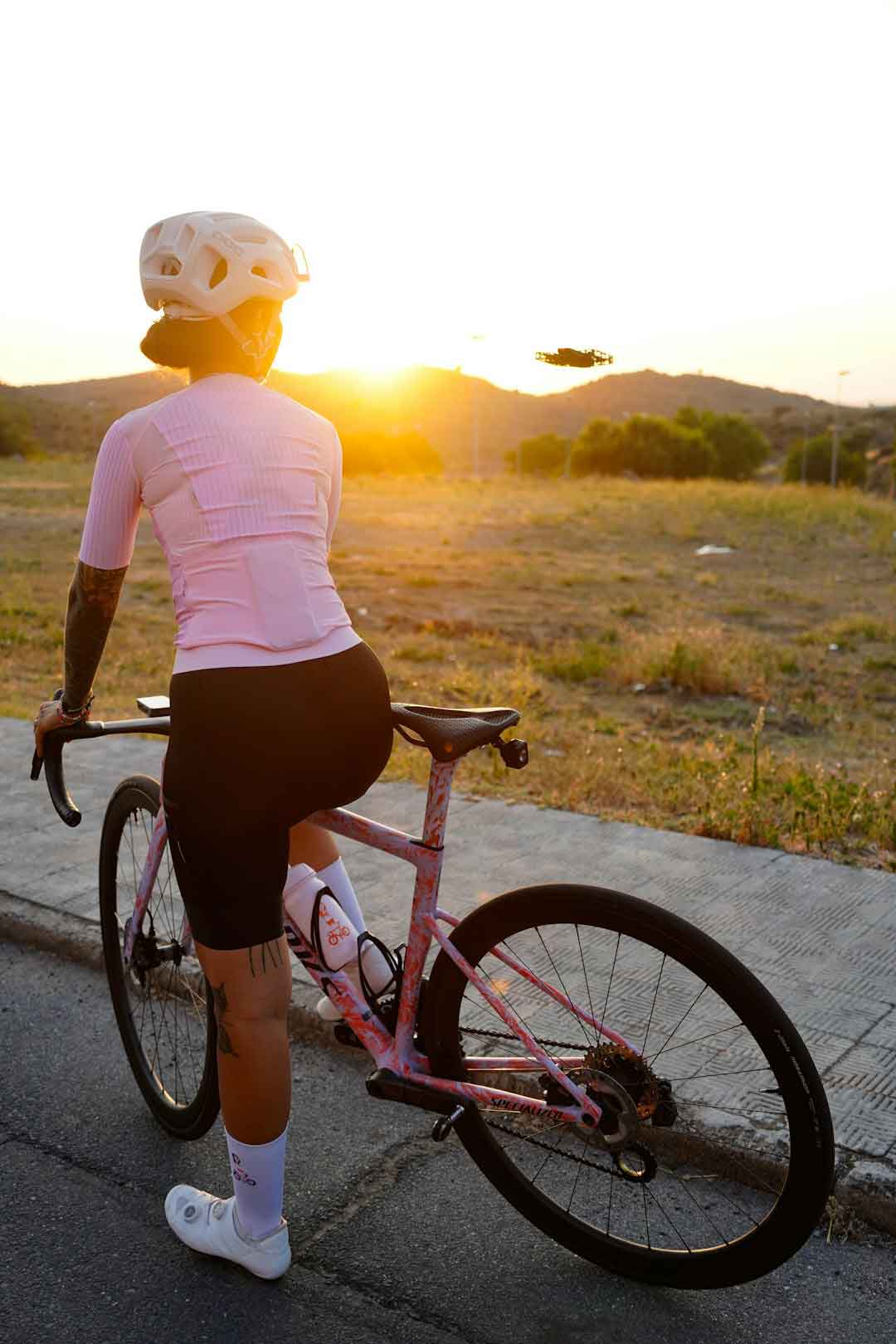 female_cyclist_at_sunset_on_a_mountain