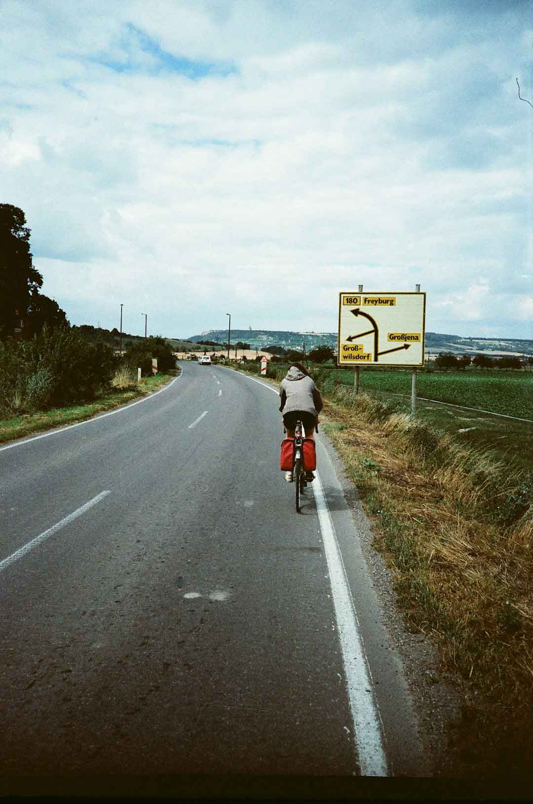 Cyclist riding a Pinarello Dogma F on a scenic road