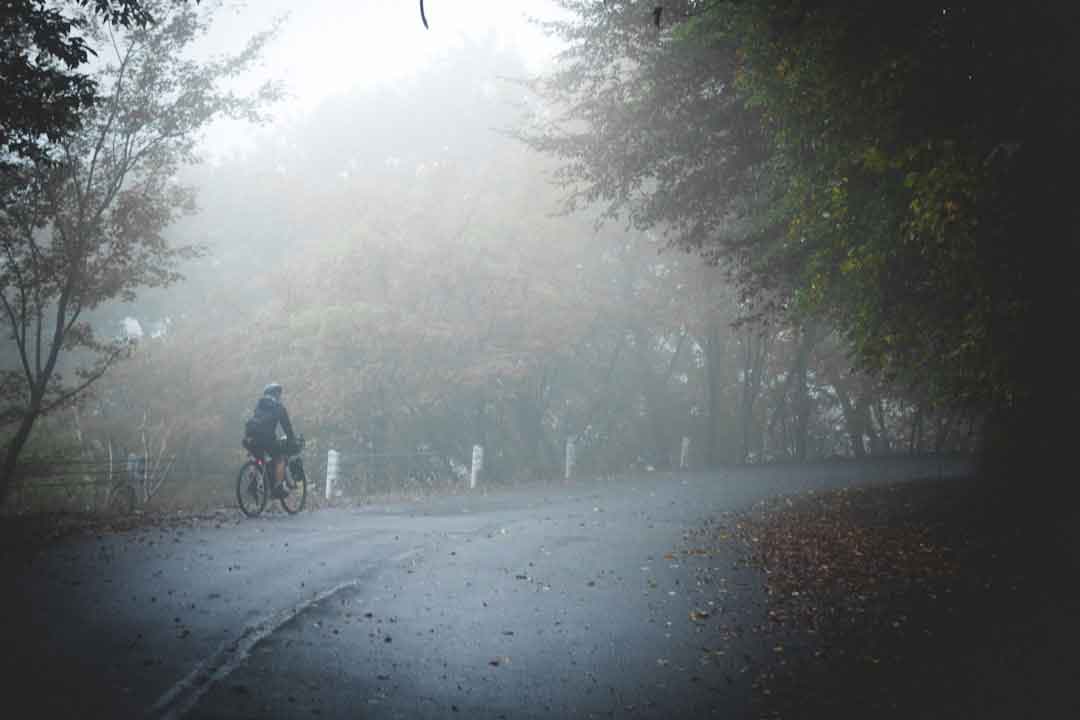Wet road and cyclist