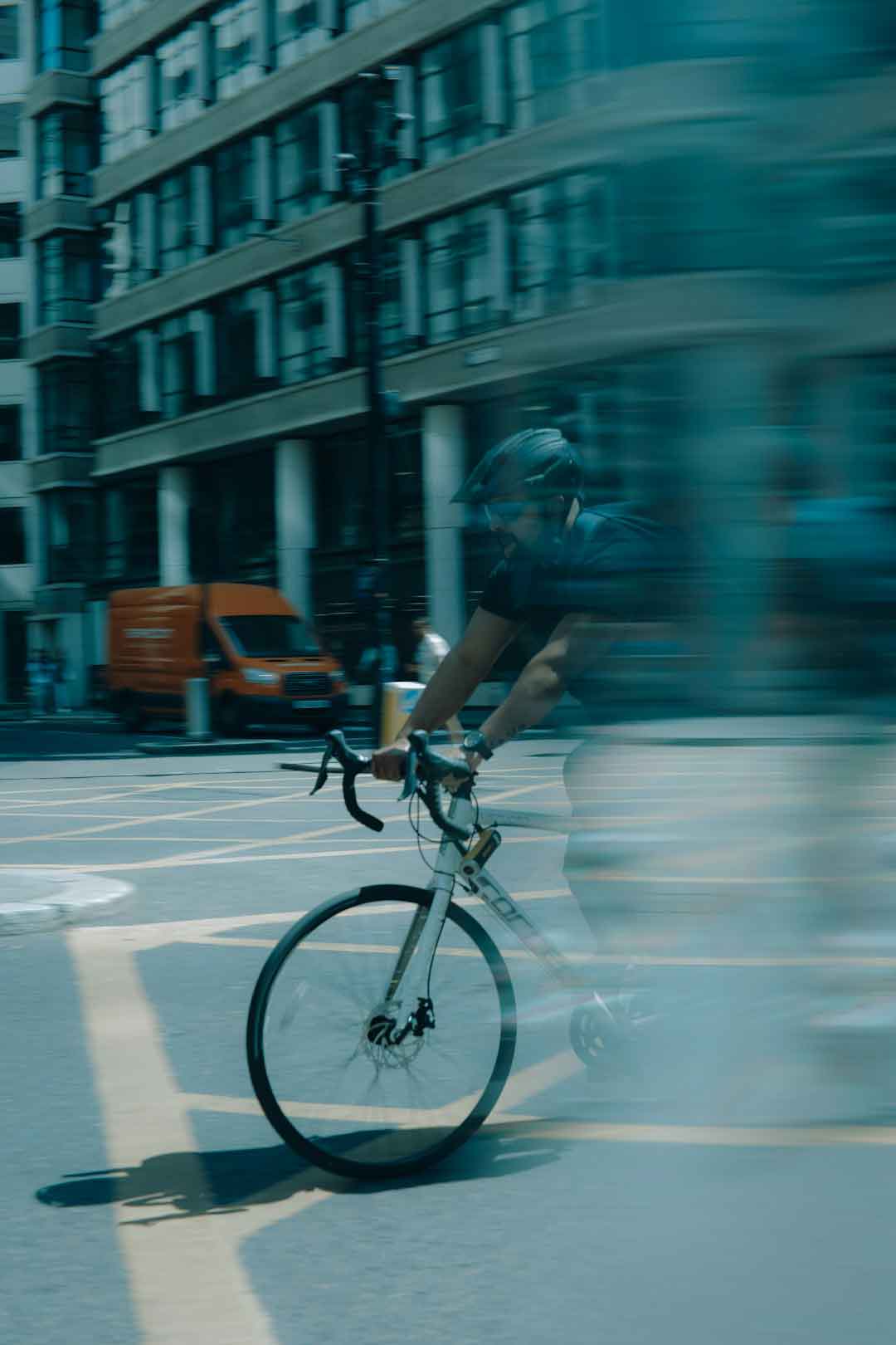 Cyclist testing a road bike on a city street
