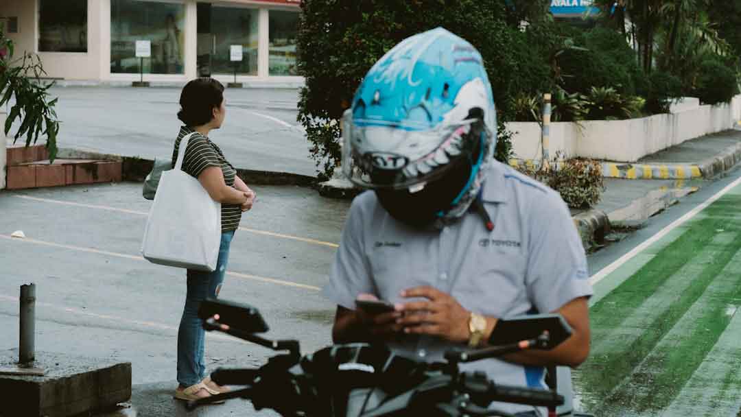 Cyclist preparing for a road bike ride with helmet and gear